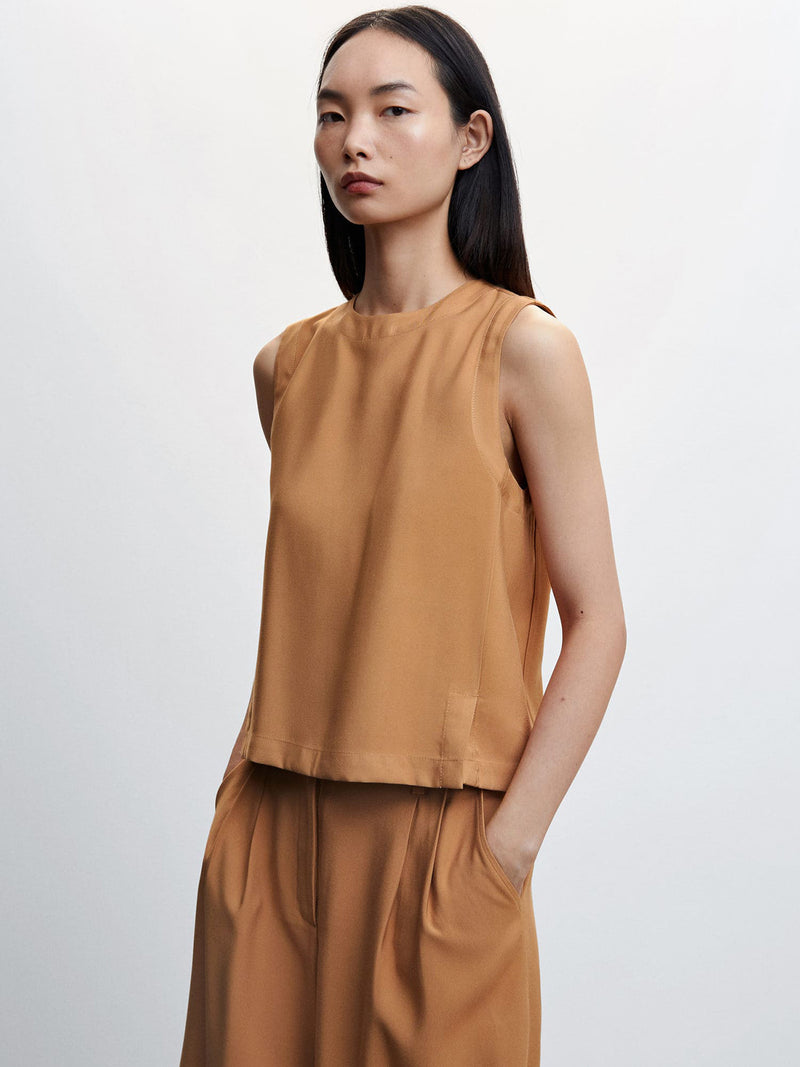 Sleeveless top with side-slit