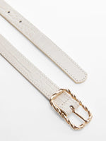 Belt with embossed buckle